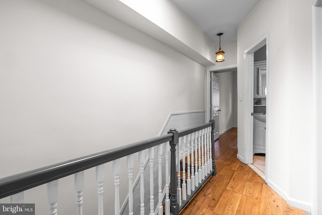 326 E 28th St, Baltimore, MD 21218 - hall with an upstairs landing and light wood-type flooring