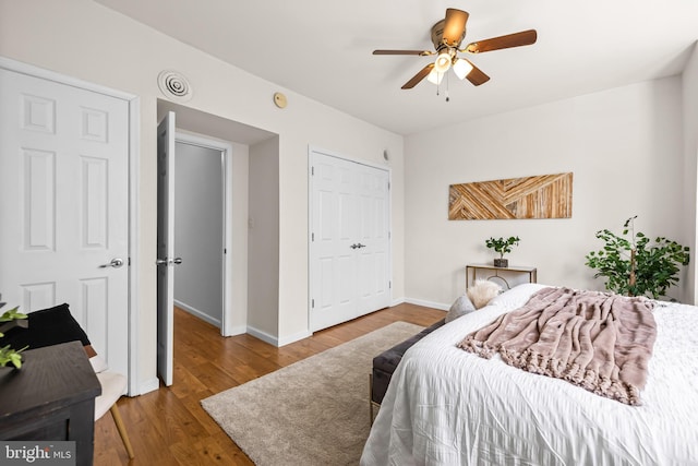 326 E 28th St, Baltimore, MD 21218 - bedroom featuring wood finished floors, baseboards, a closet, and ceiling fan