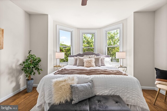 326 E 28th St, Baltimore, MD 21218 - bedroom featuring wood finished floors, baseboards, and ceiling fan