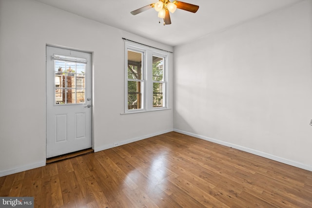 326 E 28th St, Baltimore, MD 21218 - foyer entrance featuring healthy amount of natural light, ceiling fan, wood finished floors, and baseboards