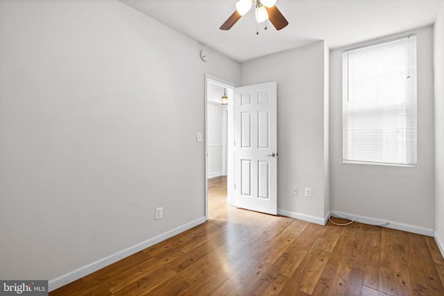 326 E 28th St, Baltimore, MD 21218 - unfurnished bedroom with hardwood / wood-style flooring, baseboards, and ceiling fan