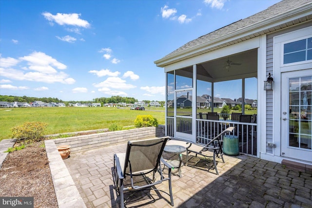 29325 Andrew Jackson Dr, Millsboro, DE 19966 - view of patio / terrace featuring a sunroom, ceiling fan, and a residential view