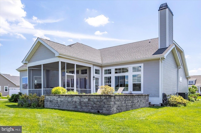 29325 Andrew Jackson Dr, Millsboro, DE 19966 - rear view of property with a lawn, a chimney, central air condition unit, a sunroom, and a shingled roof