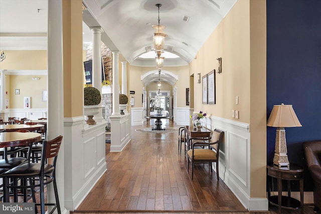 29325 Andrew Jackson Dr, Millsboro, DE 19966 - corridor featuring decorative columns, dark wood finished floors, a decorative wall, wainscoting, and crown molding