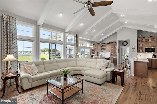 29325 Andrew Jackson Dr, Millsboro, DE 19966 - living room with beamed ceiling, high vaulted ceiling, ceiling fan, light wood finished floors, and recessed lighting