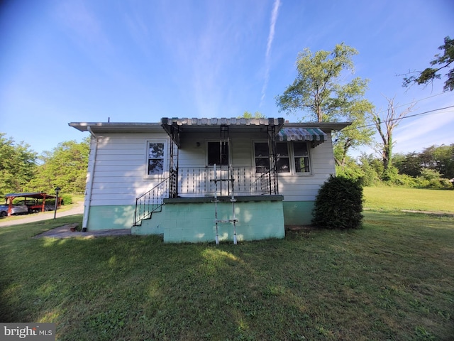 155 Hyndman Rd, Hyndman, PA 15545 - back of house with a yard and covered porch