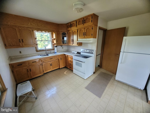 155 Hyndman Rd, Hyndman, PA 15545 - kitchen featuring white appliances, under cabinet range hood, a sink, and light countertops