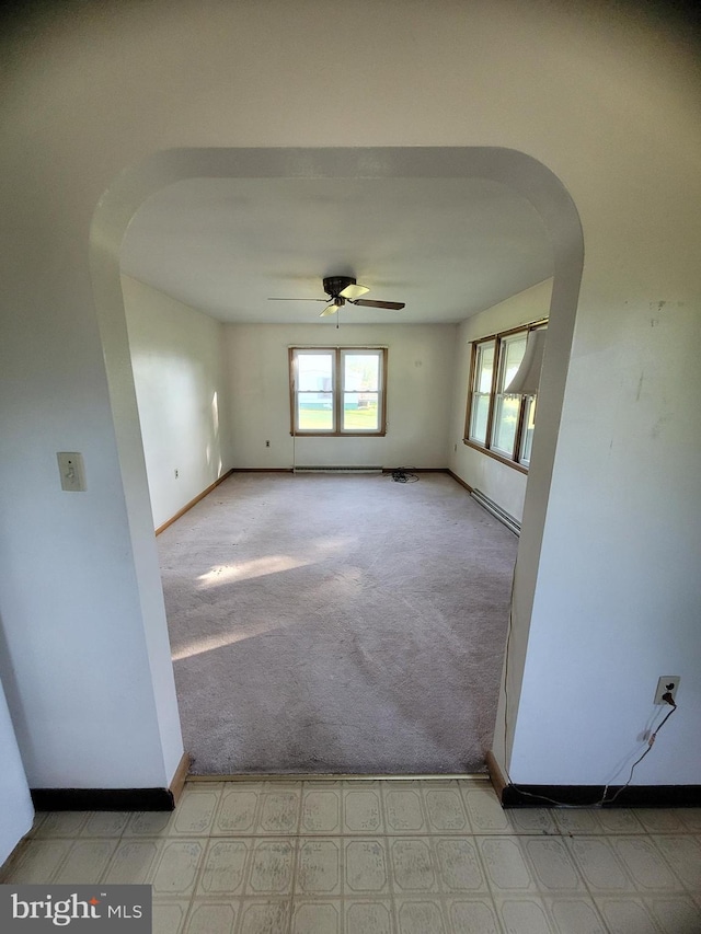 155 Hyndman Rd, Hyndman, PA 15545 - spare room featuring arched walkways, ceiling fan, baseboards, and carpet