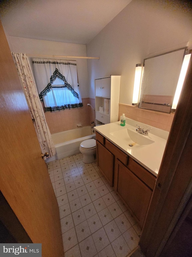 155 Hyndman Rd, Hyndman, PA 15545 - bathroom with toilet, shower / bath combo, vanity, tile patterned flooring, and a wainscoted wall