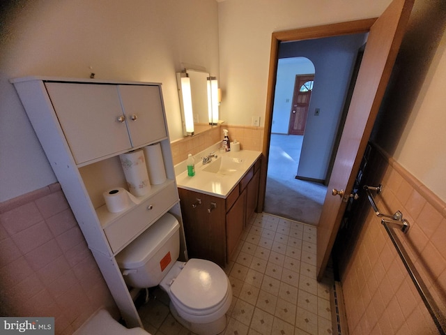 155 Hyndman Rd, Hyndman, PA 15545 - bathroom featuring toilet, tile patterned floors, vanity, and a wainscoted wall