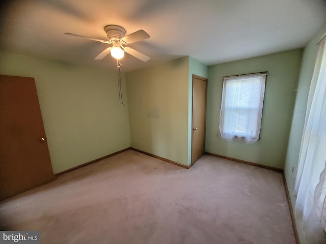 155 Hyndman Rd, Hyndman, PA 15545 - unfurnished bedroom featuring light carpet, a closet, baseboards, and ceiling fan