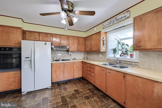 kitchen featuring white refrigerator with ice dispenser, oven, a sink, under cabinet range hood, and light countertops