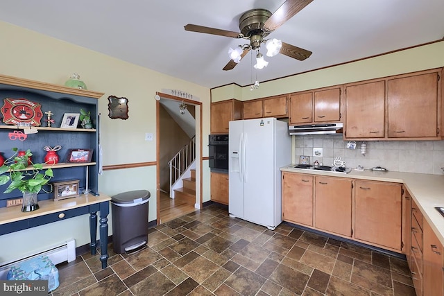 kitchen featuring black appliances, a ceiling fan, a baseboard radiator, light countertops, and tasteful backsplash
