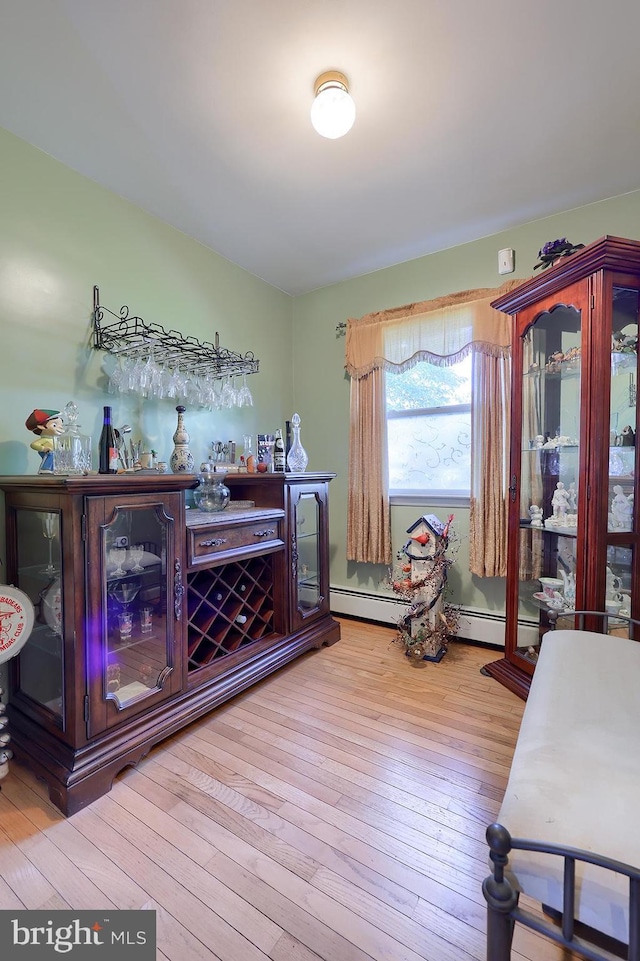 indoor dry bar with hardwood / wood-style flooring