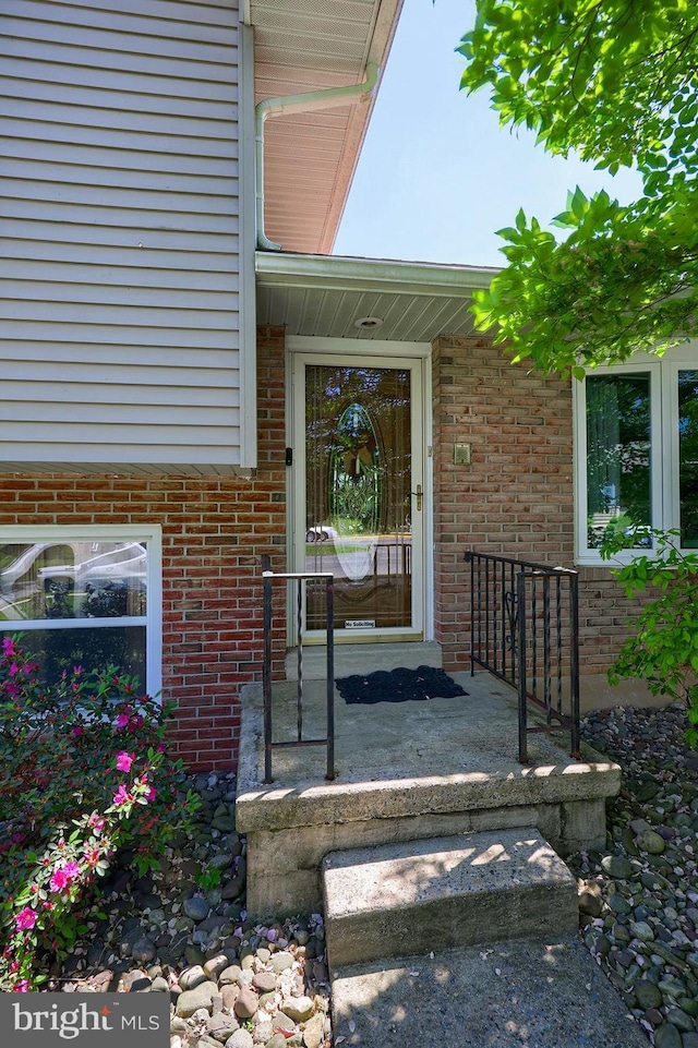 entrance to property with brick siding