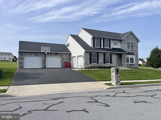 traditional home featuring stone siding, a front lawn, and an attached garage