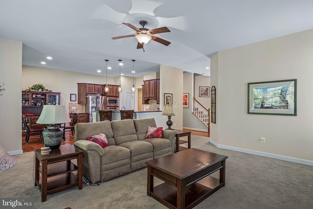 31027 Scissorbill Rd, Ocean View, DE 19970 - living area with light carpet, a ceiling fan, baseboards, stairway, and recessed lighting