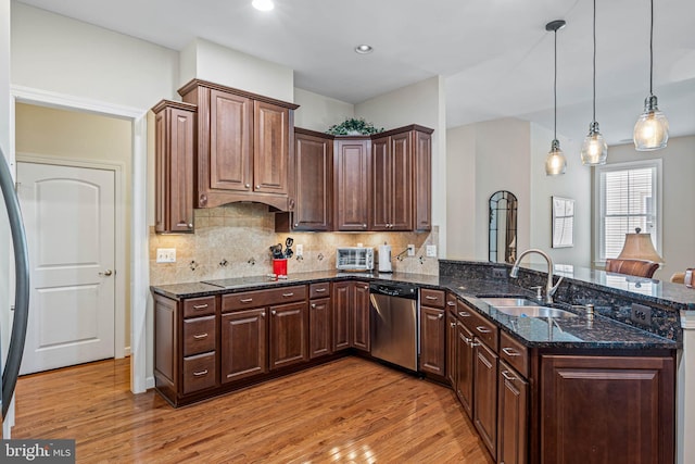 31027 Scissorbill Rd, Ocean View, DE 19970 - kitchen featuring stainless steel dishwasher, a sink, light wood finished floors, a peninsula, and recessed lighting