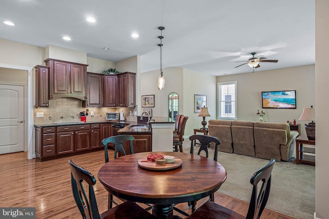 31027 Scissorbill Rd, Ocean View, DE 19970 - dining area featuring ceiling fan, light wood-style flooring, and recessed lighting