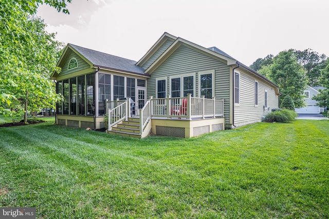 31027 Scissorbill Rd, Ocean View, DE 19970 - rear view of house featuring a sunroom, a deck, and a lawn