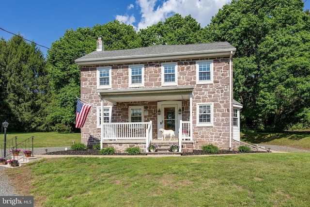 305 Gunhart Rd, Mohnton, PA 19540 - view of front facade with stone siding, a porch, a chimney, and a front yard