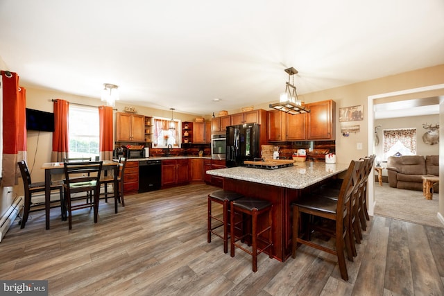 305 Gunhart Rd, Mohnton, PA 19540 - kitchen featuring black appliances, a peninsula, plenty of natural light, and a sink