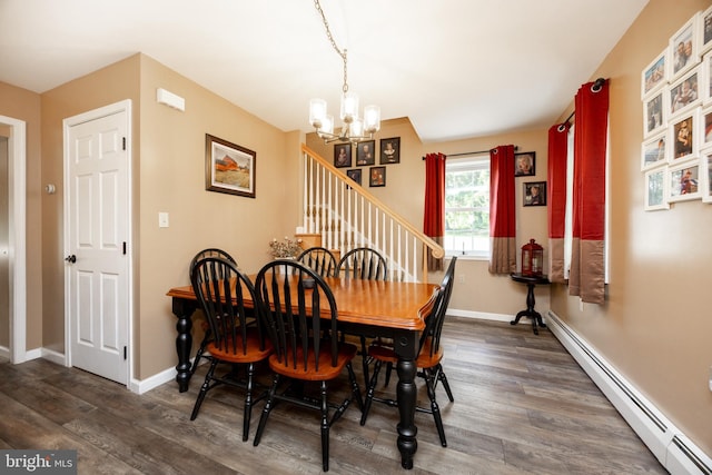 305 Gunhart Rd, Mohnton, PA 19540 - dining room with a baseboard heating unit, a chandelier, wood finished floors, and baseboards