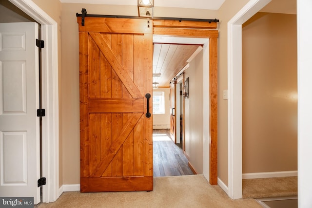 305 Gunhart Rd, Mohnton, PA 19540 - hall featuring carpet, a barn door, baseboards, and a baseboard heating unit