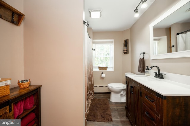305 Gunhart Rd, Mohnton, PA 19540 - full bathroom featuring baseboard heating, wood finished floors, vanity, and toilet