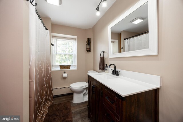 305 Gunhart Rd, Mohnton, PA 19540 - full bath featuring a baseboard radiator, wood finished floors, toilet, and vanity