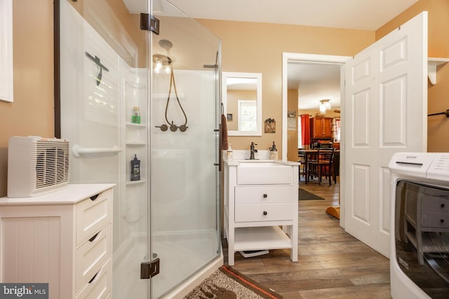 305 Gunhart Rd, Mohnton, PA 19540 - bathroom featuring a shower stall, wood finished floors, vanity, and washer / dryer