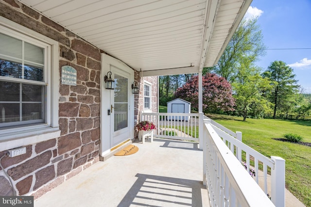 305 Gunhart Rd, Mohnton, PA 19540 - view of patio featuring a storage unit, an outdoor structure, and a porch