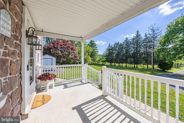 305 Gunhart Rd, Mohnton, PA 19540 - view of patio / terrace featuring a storage shed, an outdoor structure, covered porch, and view of scattered trees
