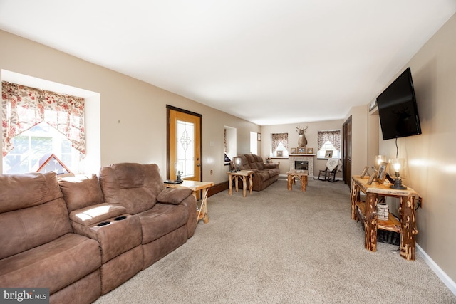 305 Gunhart Rd, Mohnton, PA 19540 - living room featuring healthy amount of natural light, light carpet, baseboards, and a glass covered fireplace