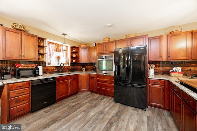305 Gunhart Rd, Mohnton, PA 19540 - kitchen with black appliances, open shelves, a sink, and backsplash