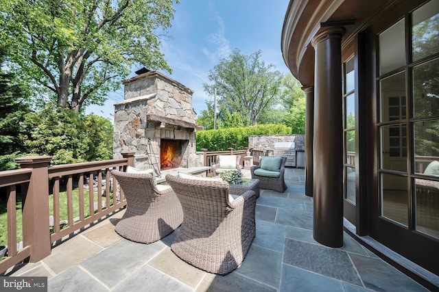 5033 Tilden St NW, Washington, DC 20016 - view of patio with an outdoor kitchen and an outdoor living space with a fireplace