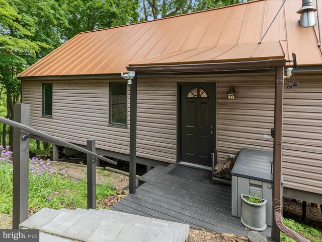 171 Honeymoon Hollow Rd, Lost City, WV 26810 - doorway to property featuring metal roof and a standing seam roof