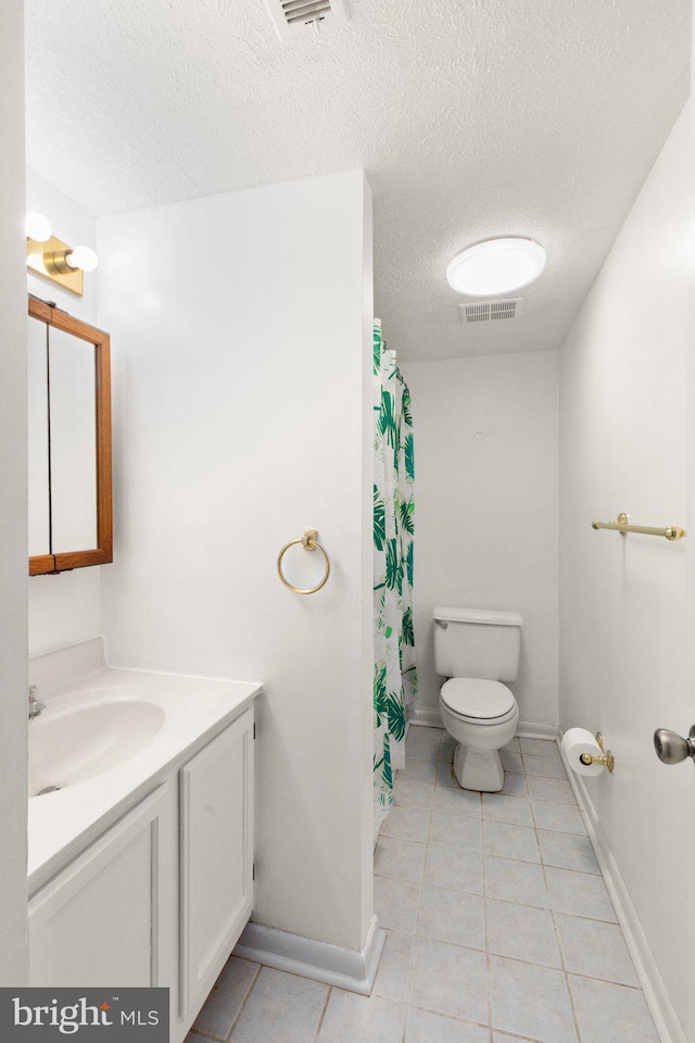 2007 Magnolia Woods Ct Unit B, Edgewood, MD 21040 - bathroom featuring a textured ceiling, vanity, tile patterned floors, and curtained shower