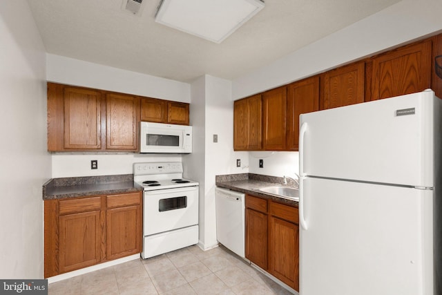 2007 Magnolia Woods Ct Unit B, Edgewood, MD 21040 - kitchen with white appliances, dark countertops, and brown cabinets