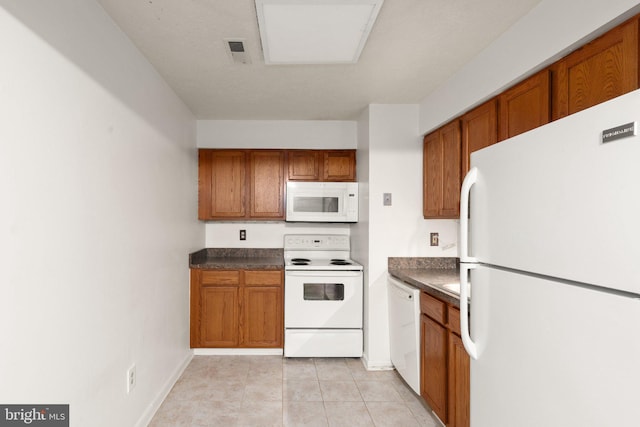 2007 Magnolia Woods Ct Unit B, Edgewood, MD 21040 - kitchen featuring white appliances, dark countertops, brown cabinets, and light tile patterned floors
