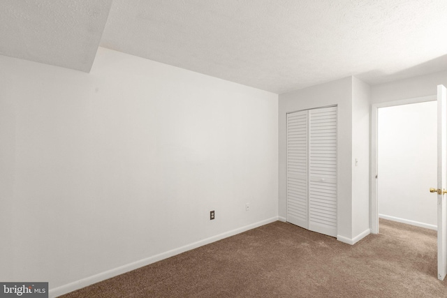 2007 Magnolia Woods Ct Unit B, Edgewood, MD 21040 - unfurnished bedroom featuring carpet flooring, a closet, and a textured ceiling