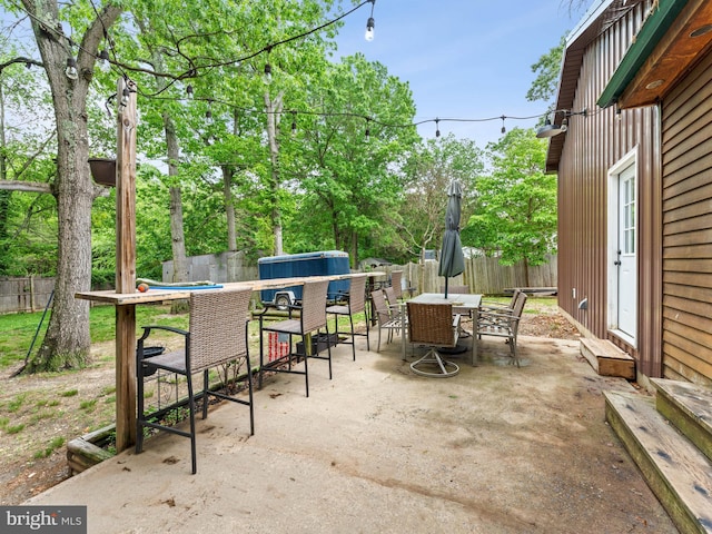 view of patio with a fenced backyard and outdoor dining area