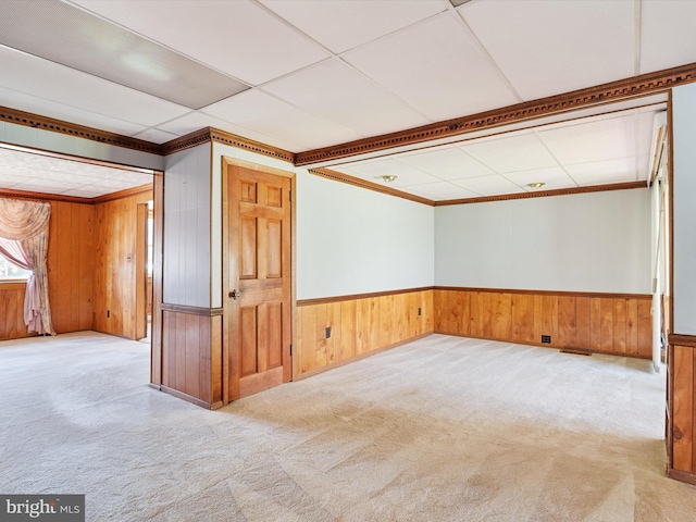108 S 2nd St, Denton, MD 21629 - carpeted empty room featuring wooden walls, crown molding, and wainscoting