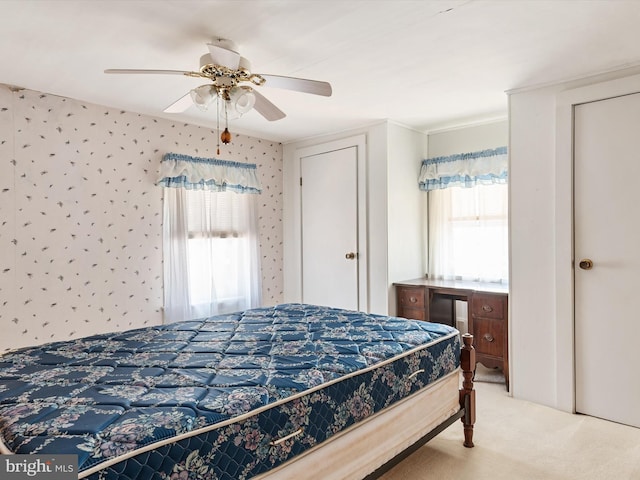 108 S 2nd St, Denton, MD 21629 - carpeted bedroom with multiple windows, a ceiling fan, and wallpapered walls