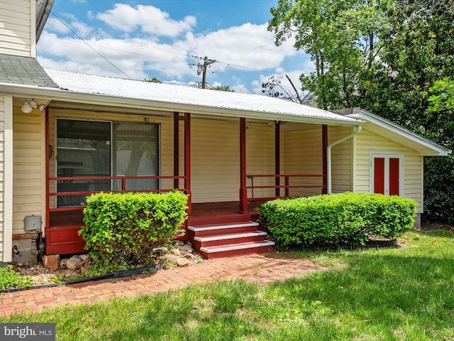 108 S 2nd St, Denton, MD 21629 - view of front of home with covered porch and metal roof