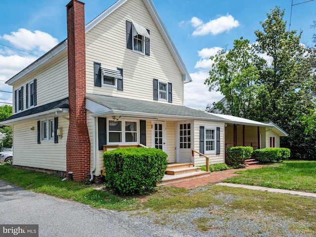 108 S 2nd St, Denton, MD 21629 - view of front of property featuring a chimney and covered porch