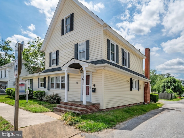 108 S 2nd St, Denton, MD 21629 - view of front of house featuring a chimney