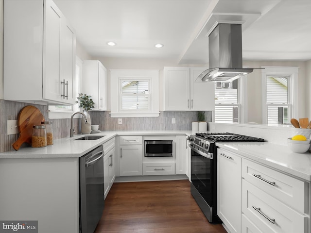 2912 Shirey Ave, Baltimore, MD 21214 - kitchen featuring appliances with stainless steel finishes, a sink, island range hood, white cabinetry, and recessed lighting