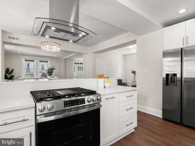 2912 Shirey Ave, Baltimore, MD 21214 - kitchen with stainless steel appliances, island range hood, white cabinetry, a chandelier, and dark wood-style flooring