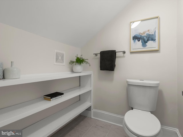 2912 Shirey Ave, Baltimore, MD 21214 - bathroom with lofted ceiling, toilet, and baseboards